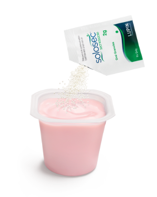 packet of solosec pouring into yogurt packet of solosec pouring into yogurt